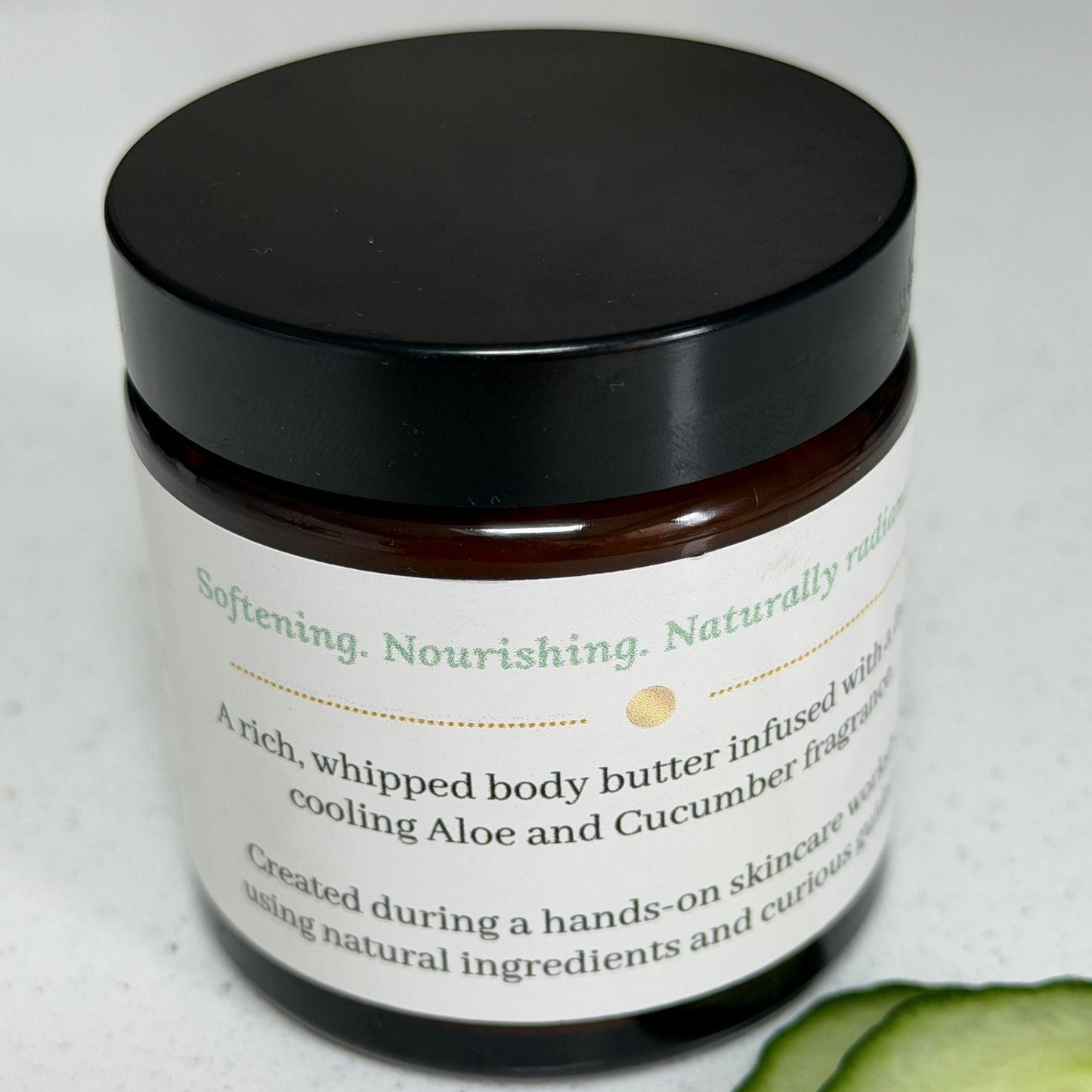 Aloe & Cucumber Whipped Body Butter by Ita's Natural Essentials with fresh cucumber slices, handmade for dry and sensitive skin.