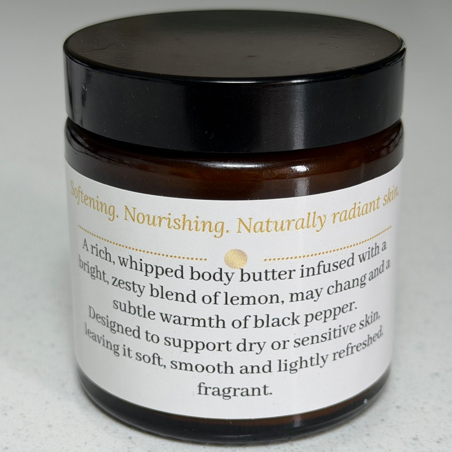 Ita's Natural Essentials Citrus Delight Whipped Body Butter – amber glass jar with black lid showing product label, natural whipped body butter with lemon, may chang and black pepper essential oils for dry and sensitive skin, handmade in Lancashire

